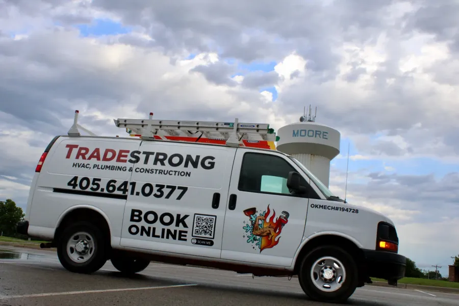 TradeStrong service van parked in front of the Moore, Oklahoma water tower
